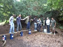 Offsite team building training - river crossing (dry) using planks and barrels